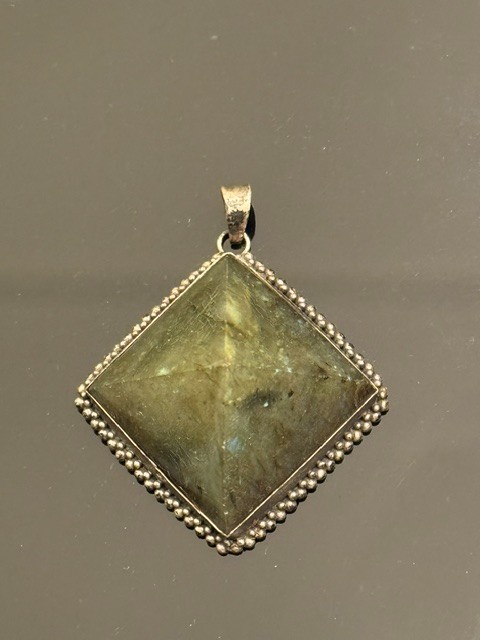 Square-cut natural labradorite pendant set in a textured silver frame. Vintage.