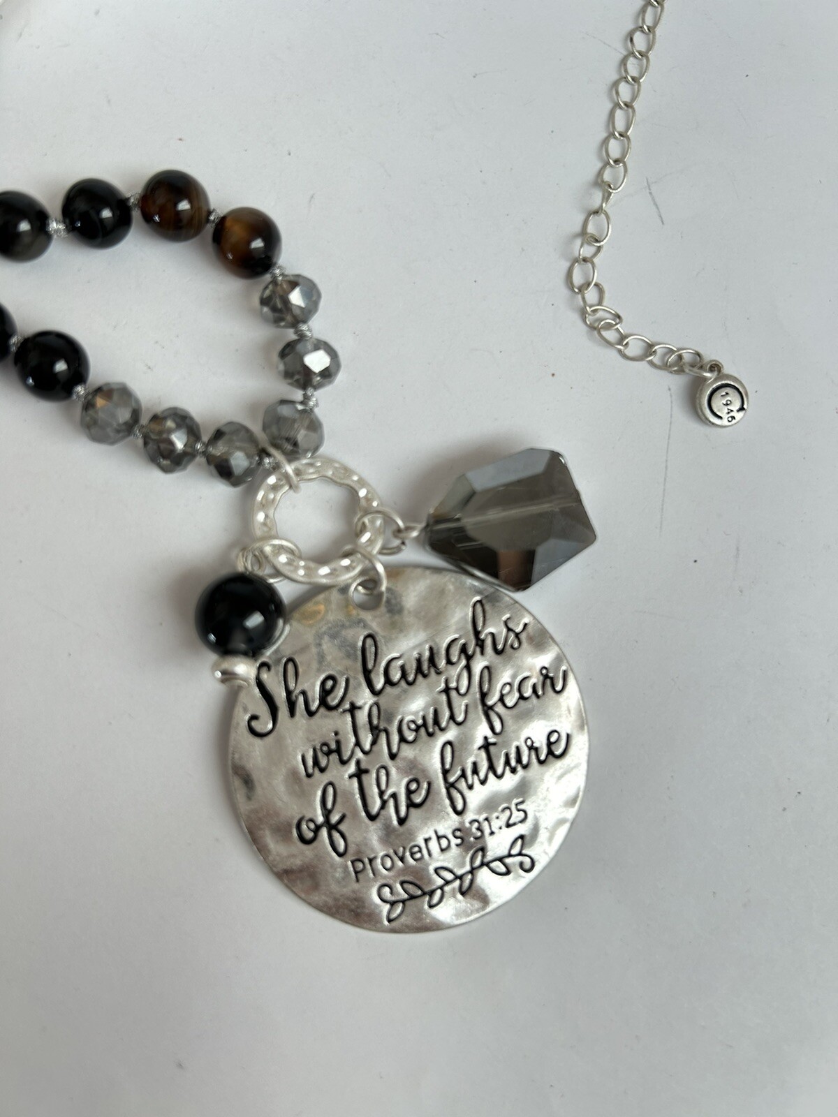 1946 “She Laughs Without Fear of the Future” silver tone long Pendant necklace