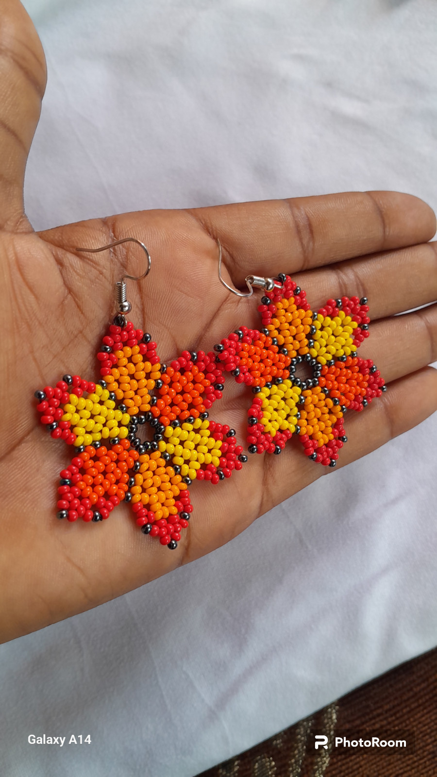 42 BEADED HANDMADE BRACELETS AND 28 PAIRS OF BEADED HANDMADE EARRINGS(LOT OF 70)