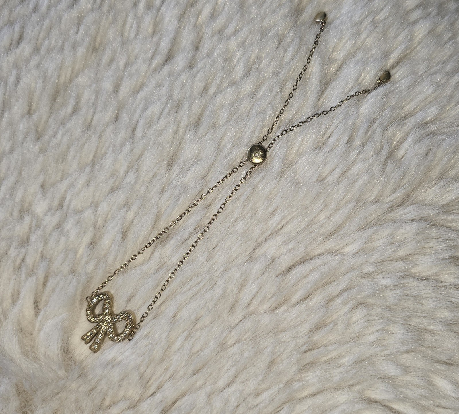 Coach New York Pave Bow Slider Bracelet Gold toned Clear Crystals