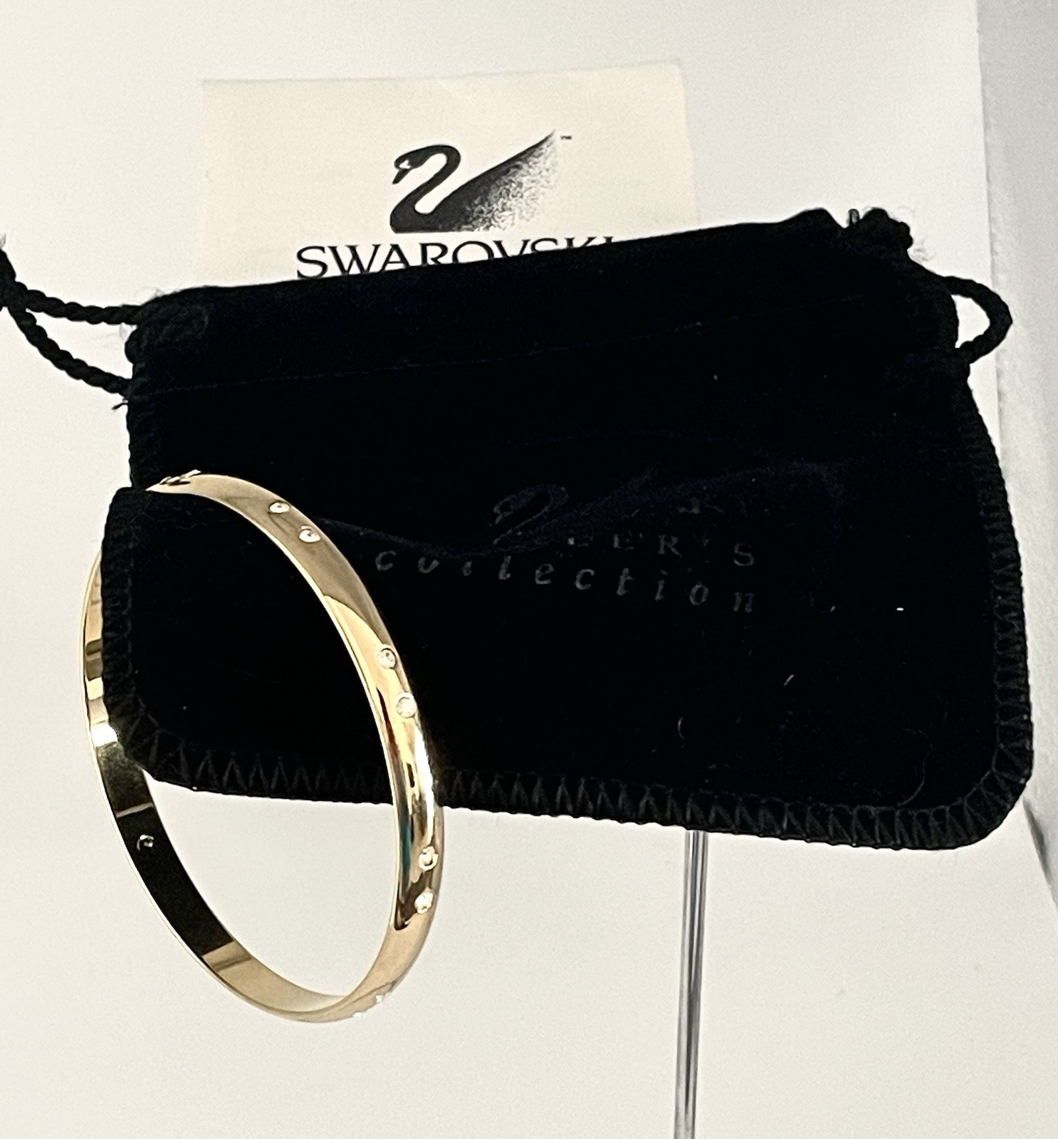 Swarovski Gold Tone Bangle Bracelet with Scattered Crystal Accents Swan Logo