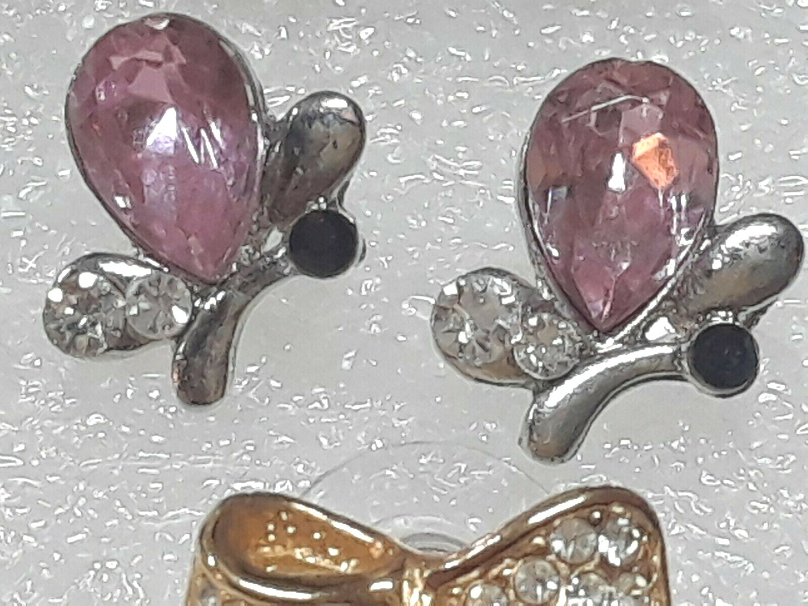 Pierced earrings with stones. pink, purple, clear. gold tone silver tone. 8 pair