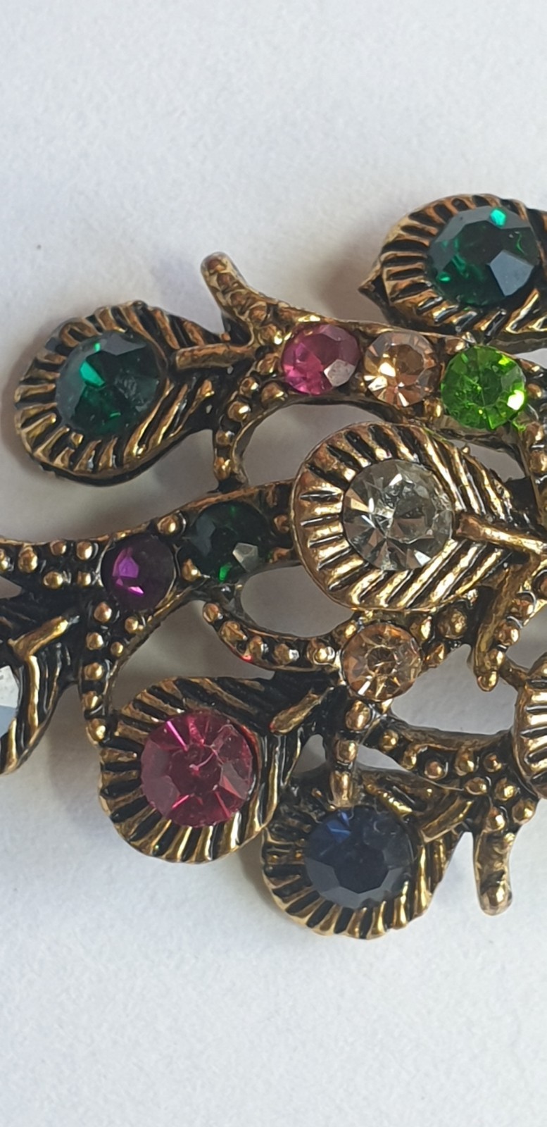 Peacock Brooch. Gold tone with Multicoloured glass beads . 84mm x 28mm.