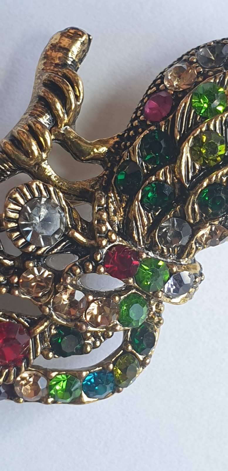 Peacock Brooch. Gold tone with Multicoloured glass beads . 84mm x 28mm.