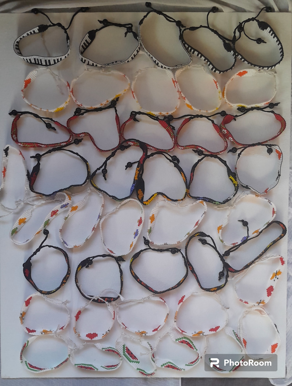 42 BEADED HANDMADE BRACELETS AND 28 PAIRS OF BEADED HANDMADE EARRINGS(LOT OF 70)