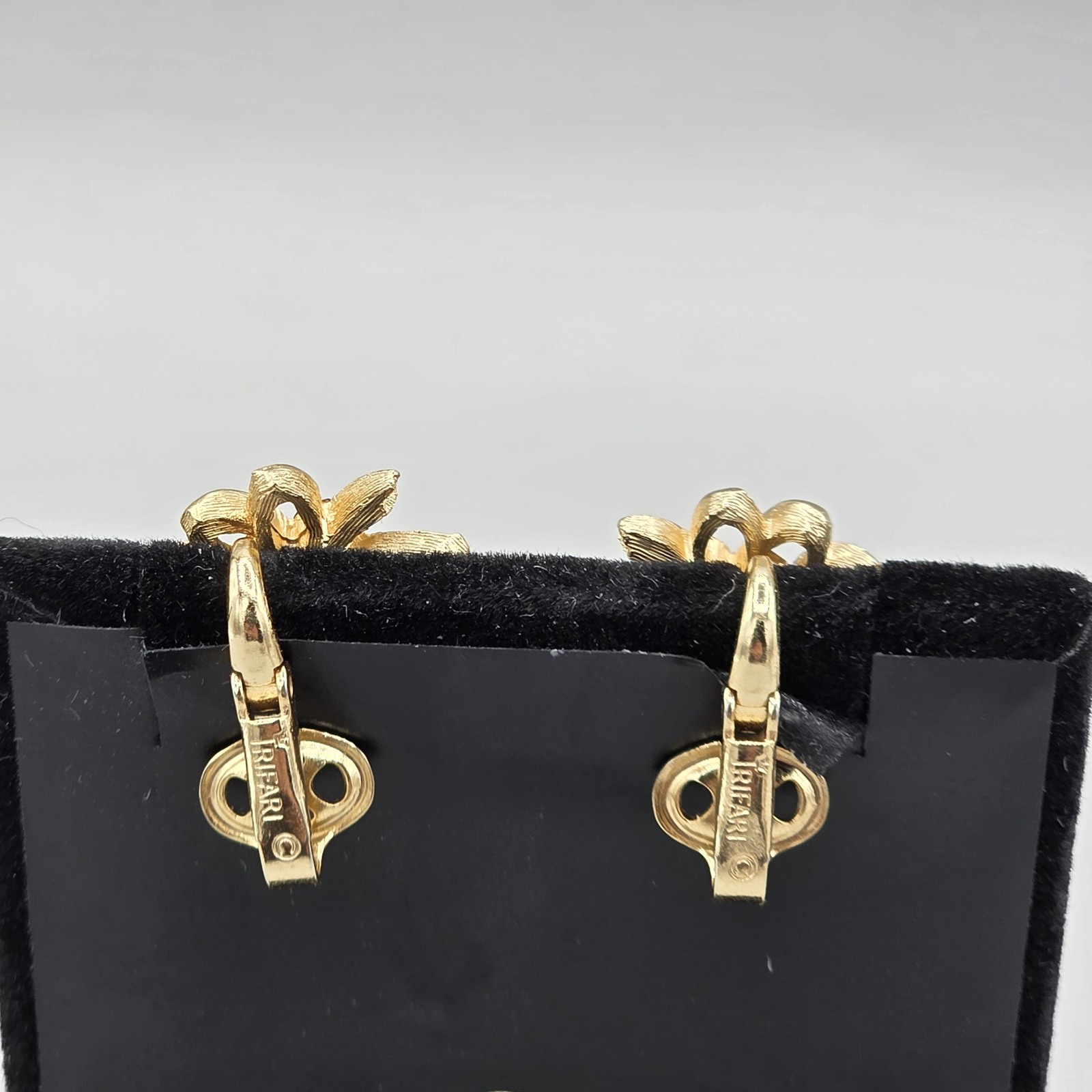 Vintage Trifari Gold Tone Floral Clip On Earrings with Brown Rhinestones