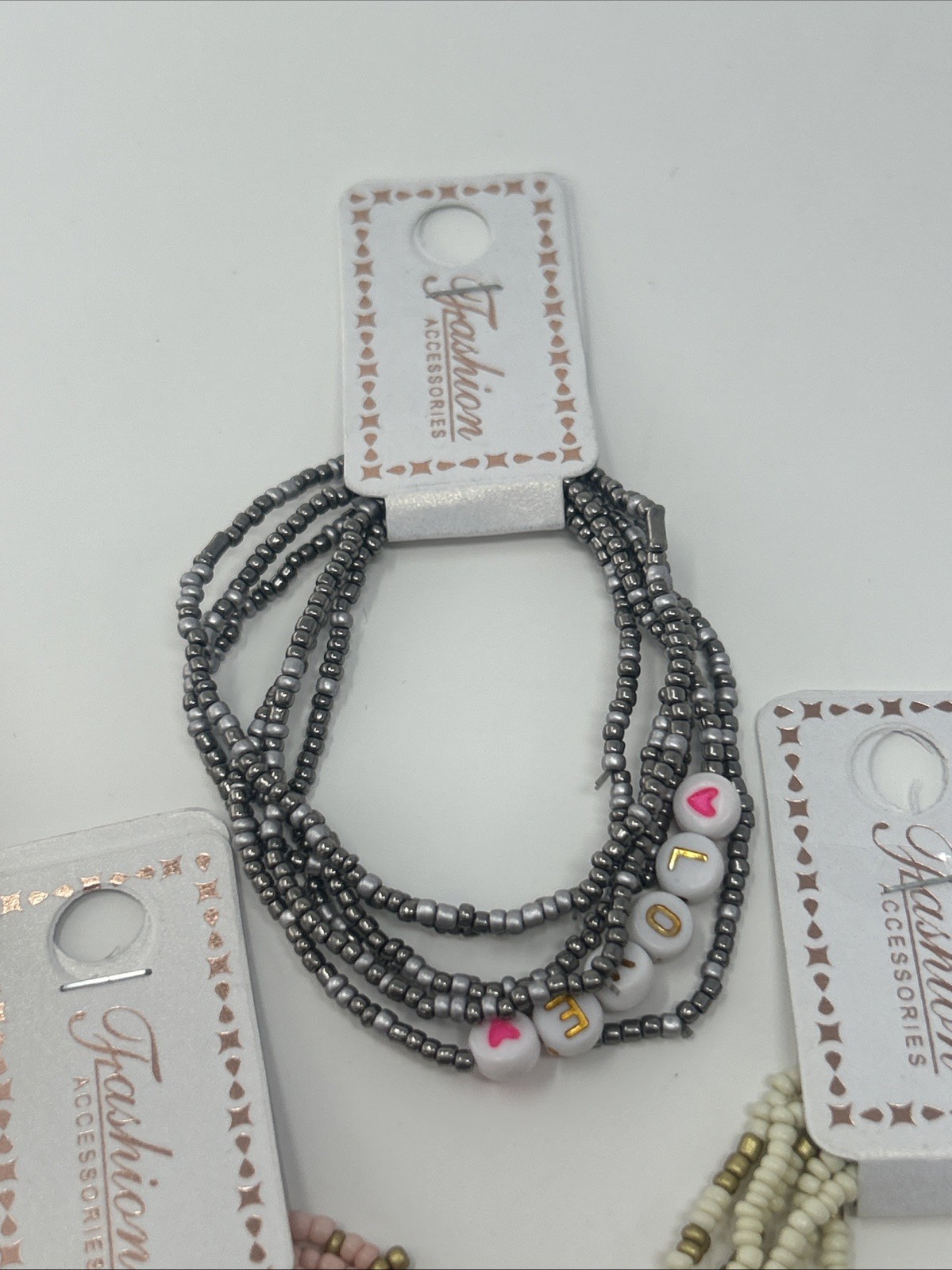 4 NWT Fashion Accessories Stacked Elastic Bead LOVE Bracelets Pink Cream Silver