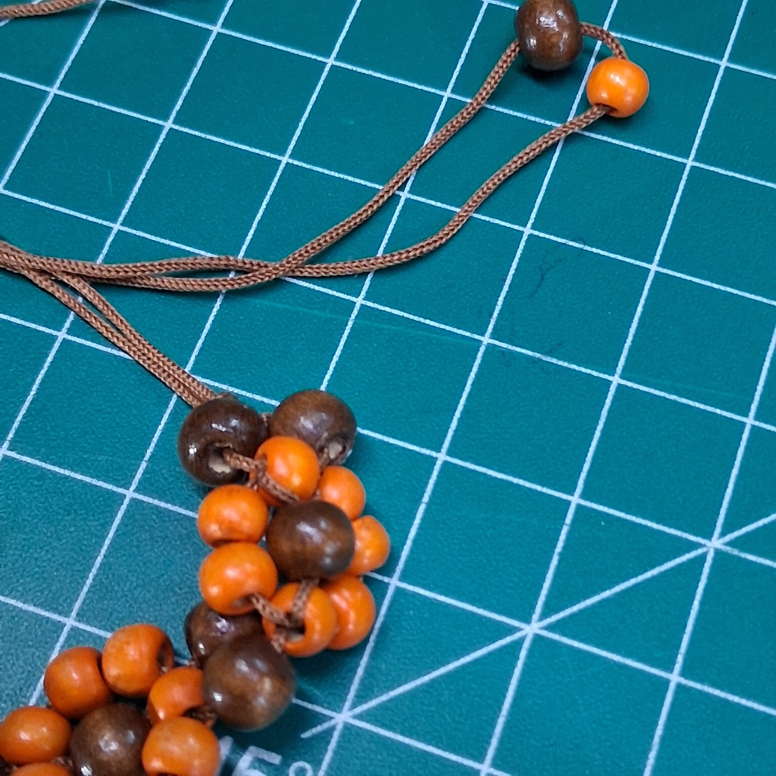 Orange & Natural Wood Channel Set Bead Adjustable Size Brown Cord Bracelet