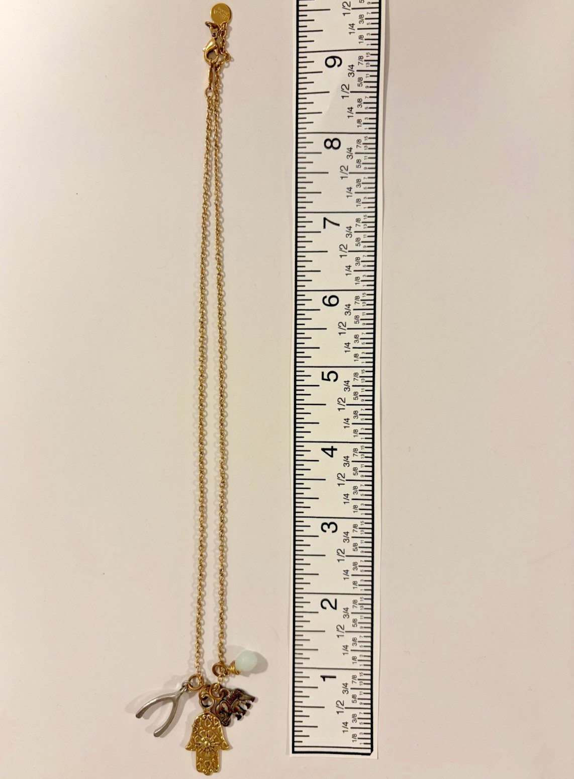 LEILA Jewelry Gold Tone Lucky Charm Necklace w/ Hamsa, Elephant & Wishbone 18in