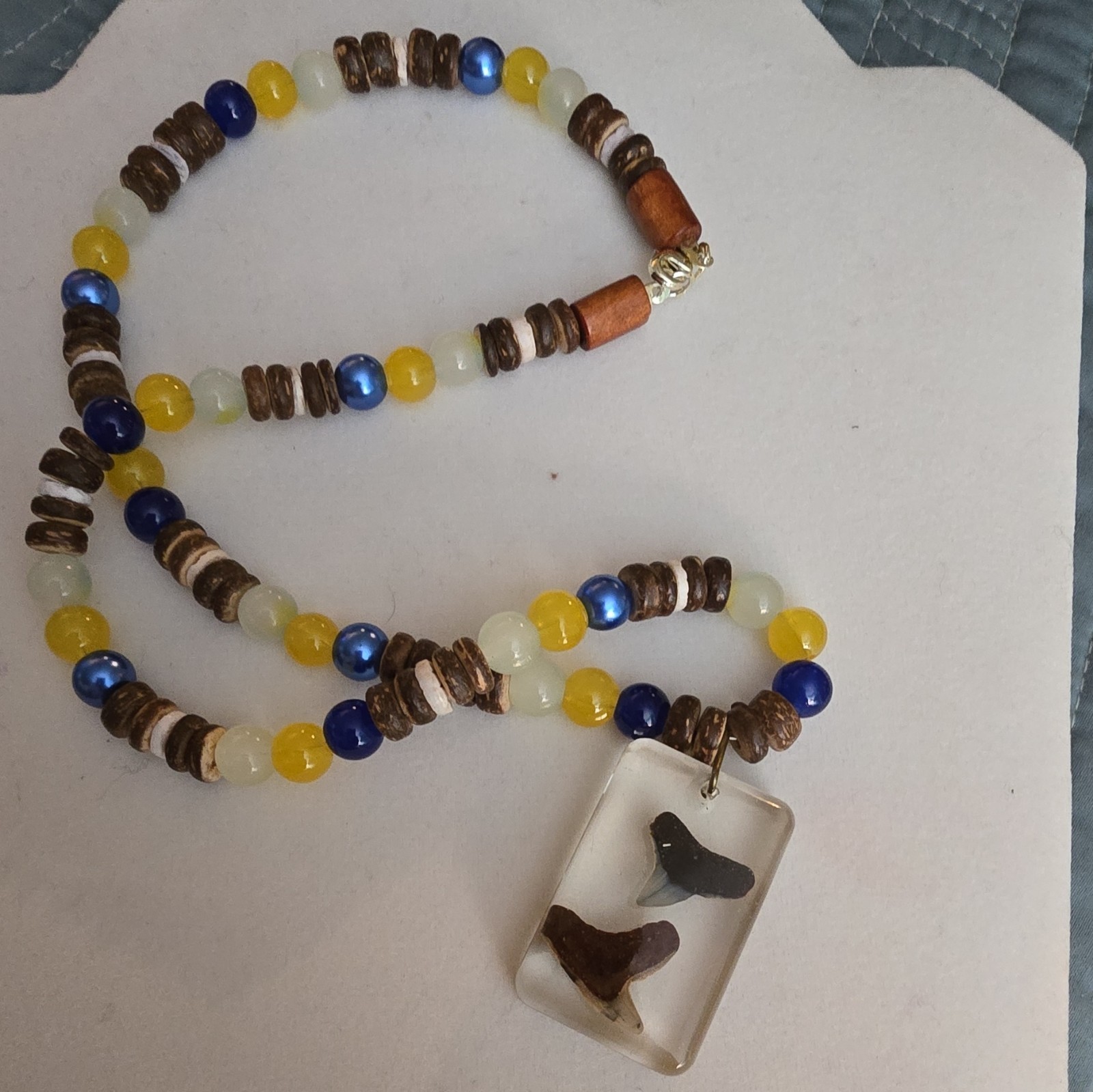 Beaded Necklace with Resin Shark Tooth Pendant, Glass And Coconut Shell Beads
