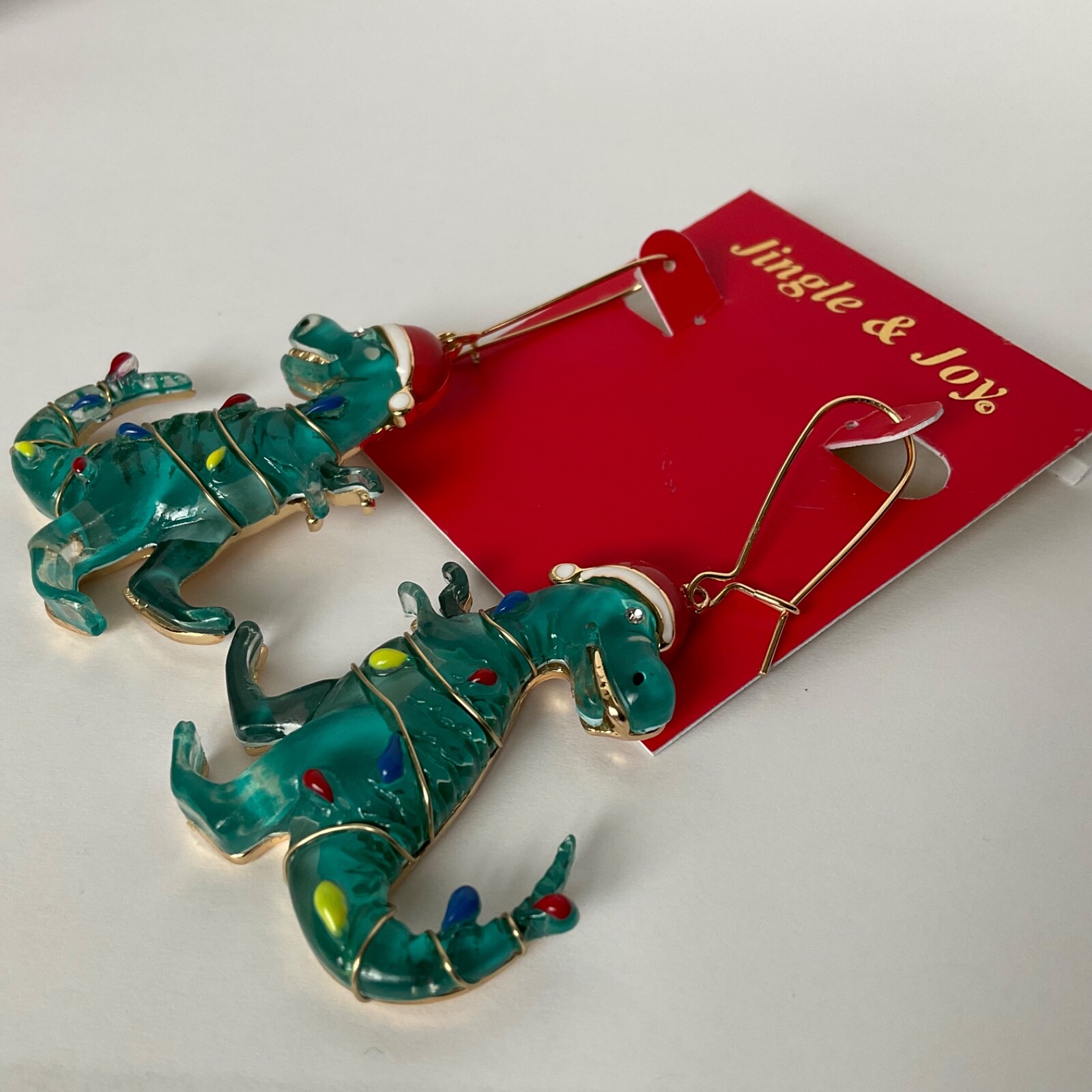 T-Rex Christmas Dinosaur Earrings Wearing Christmas Lights & Santa Hat