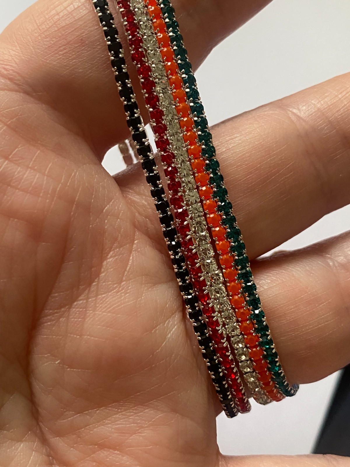 5 stretchy bracelets and 4 stretchy rings, shiny and new