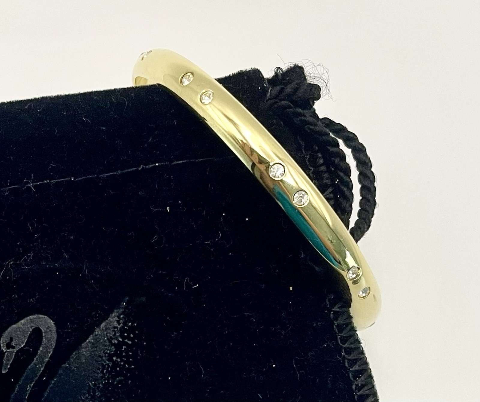 Swarovski Gold Tone Bangle Bracelet with Scattered Crystal Accents Swan Logo