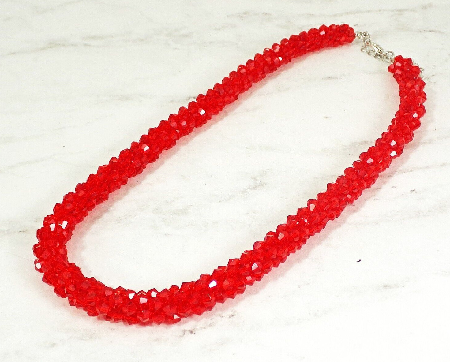 Red glass beaded necklace in a sparkling thick cluster beaded rope design New