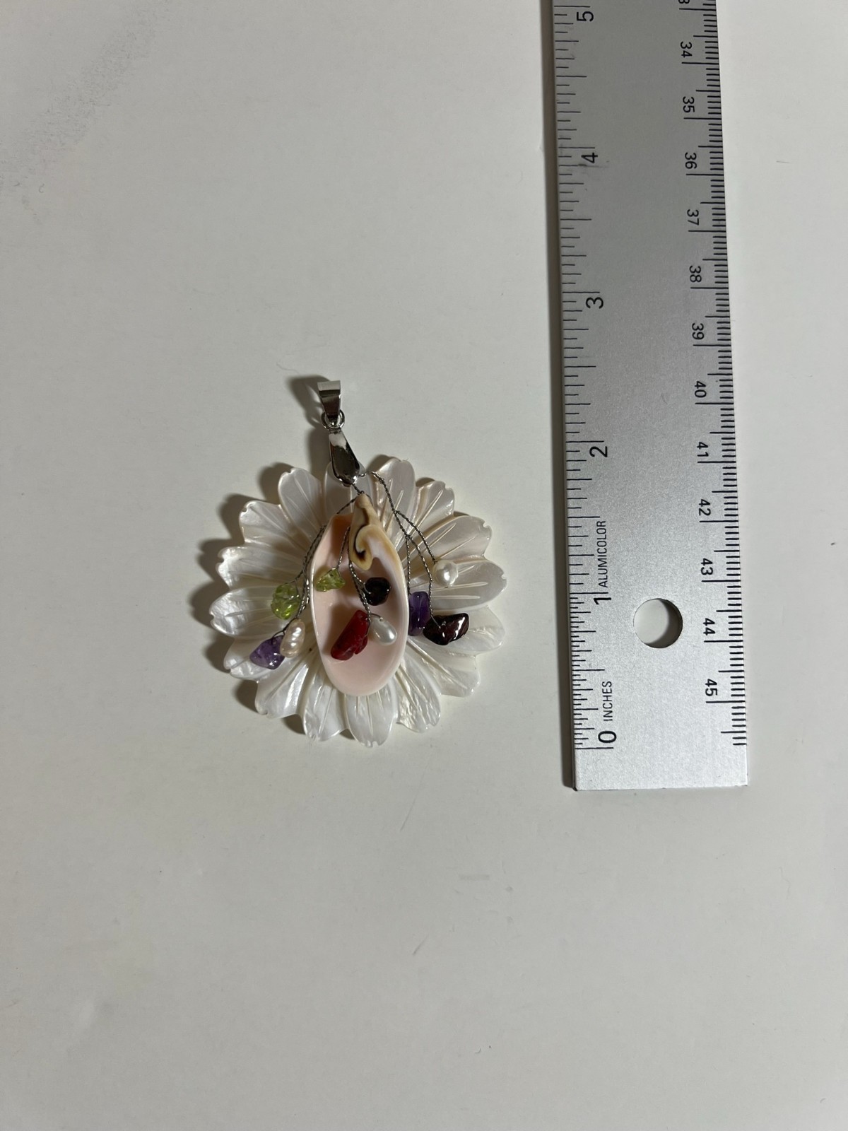 Handcarved Mother of Pearl Shell Floral Pendant. No maker mark found.
