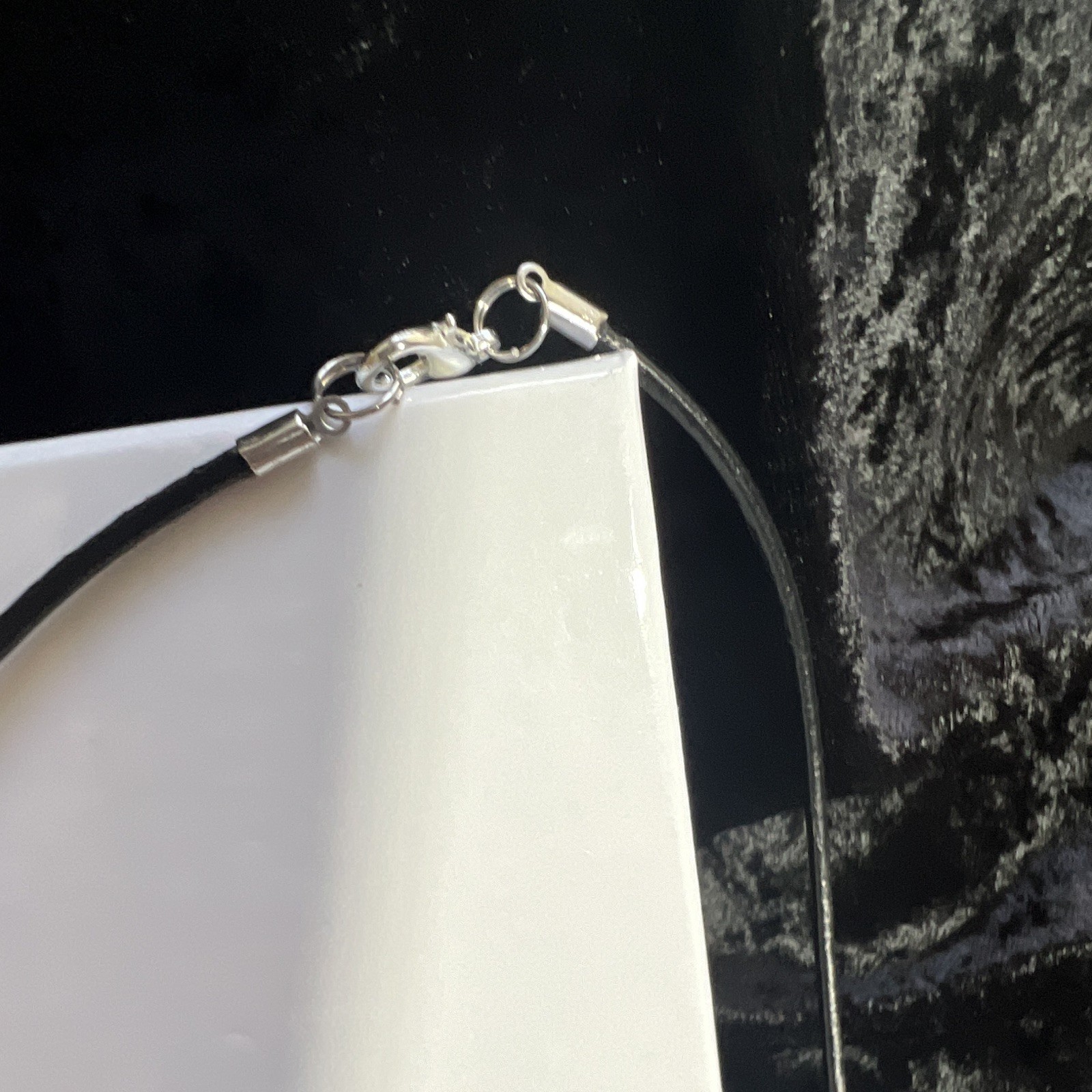 Angel pendant,inscribed, clear, crystal Aurora Borealis, leather lobster clasp.