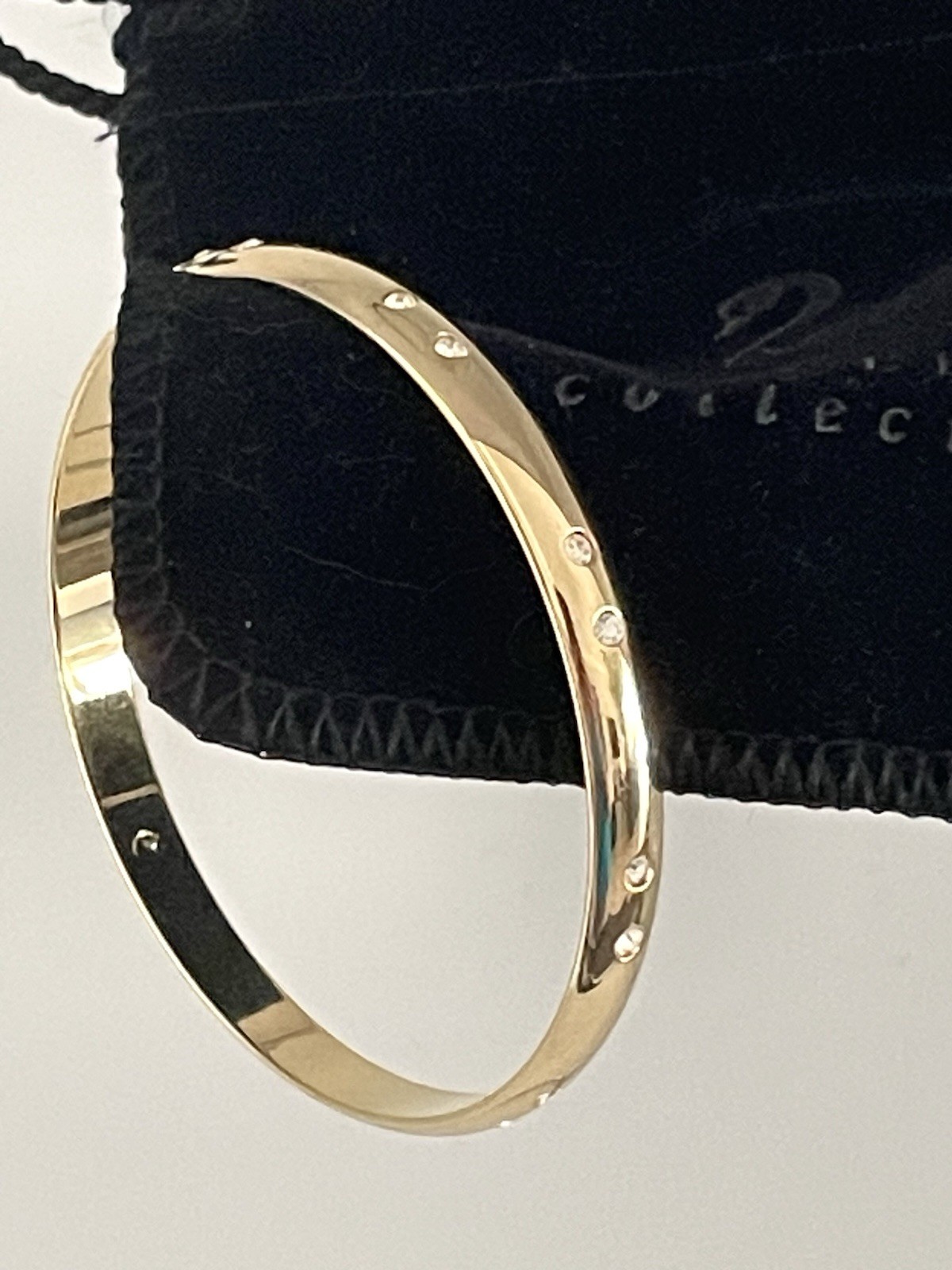 Swarovski Gold Tone Bangle Bracelet with Scattered Crystal Accents Swan Logo