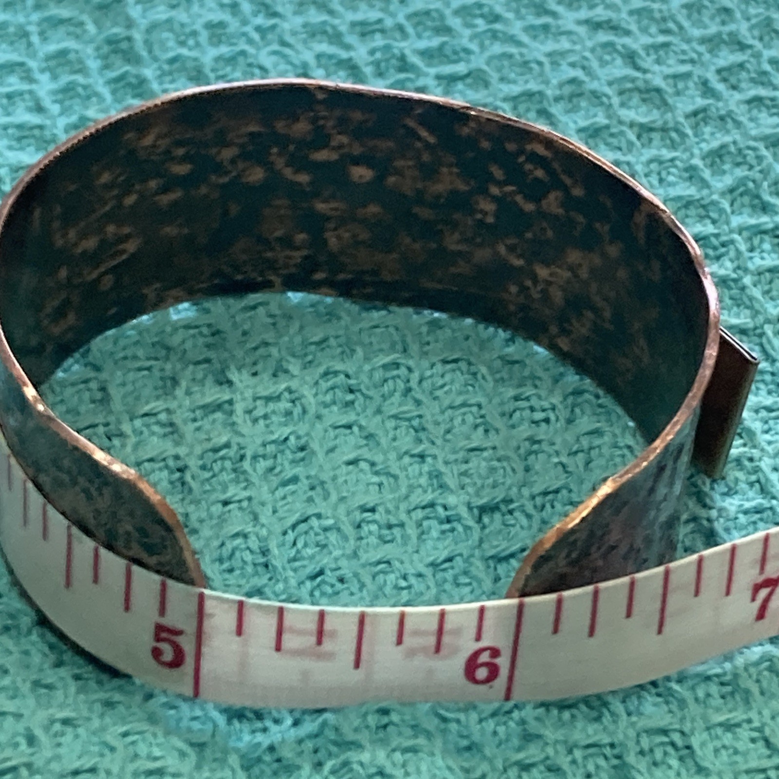Wide floral embossed copper open-ended cuff bracelet, size 6.5 in, no stone