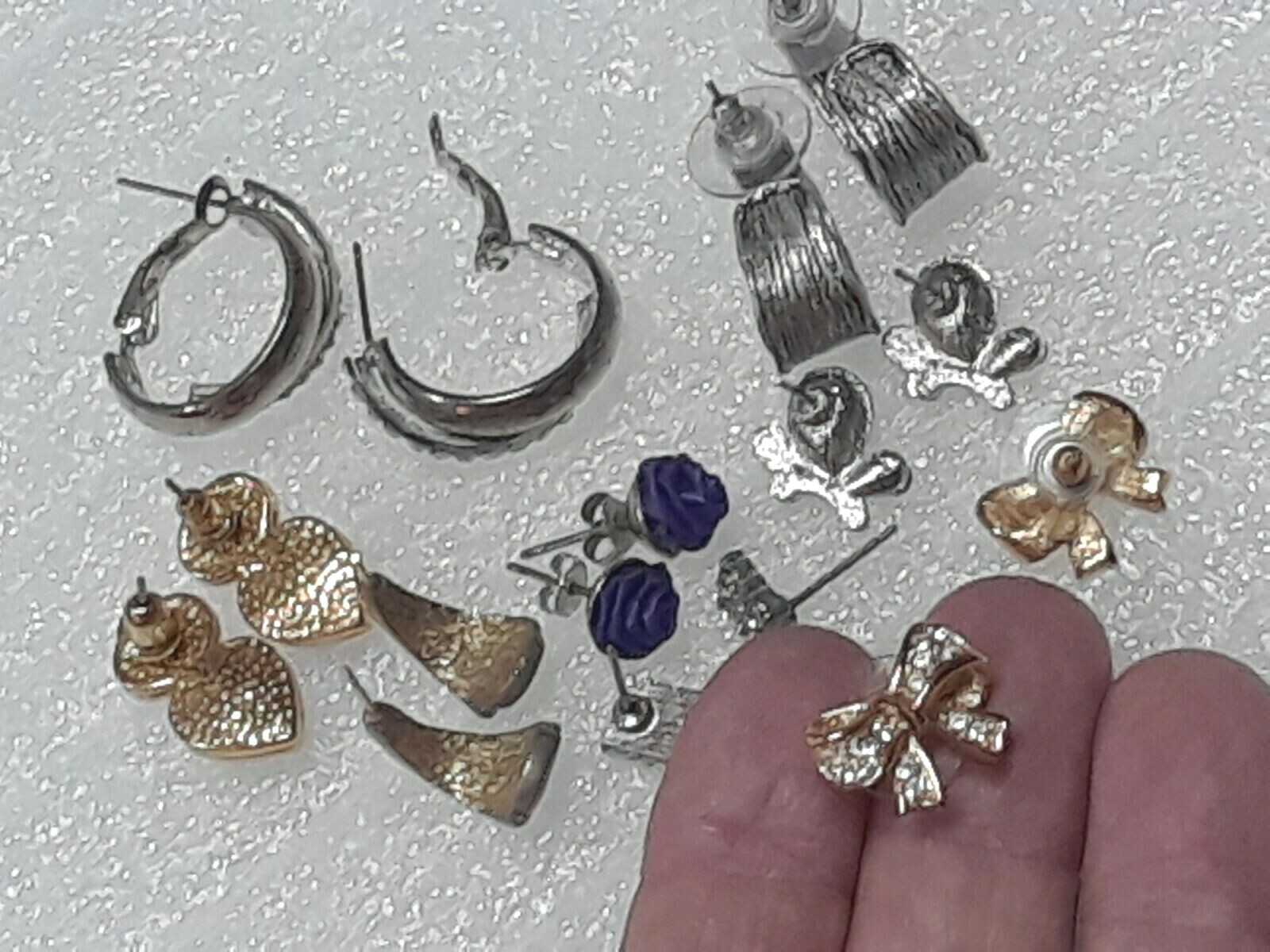 Pierced earrings with stones. pink, purple, clear. gold tone silver tone. 8 pair
