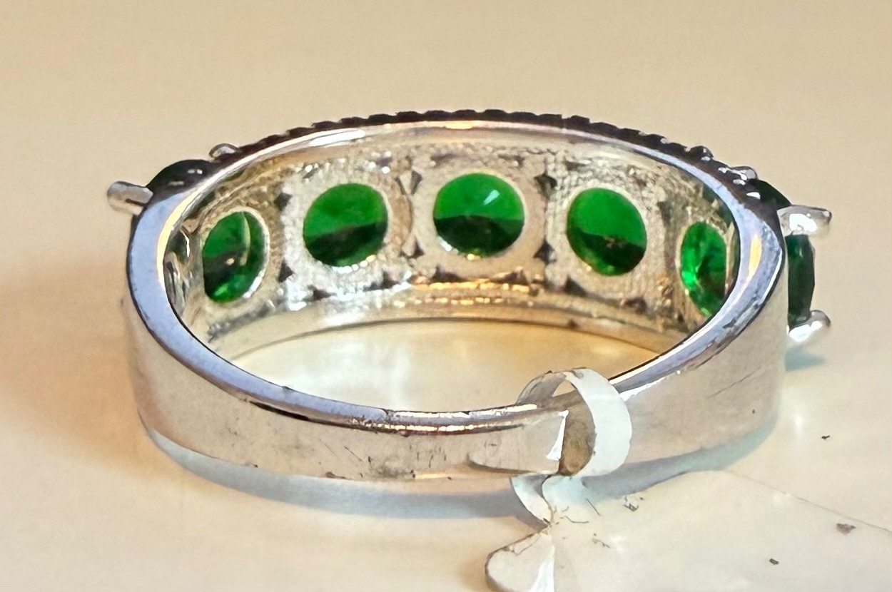 Simulated green diamond ring set in silver tone, size 8.5