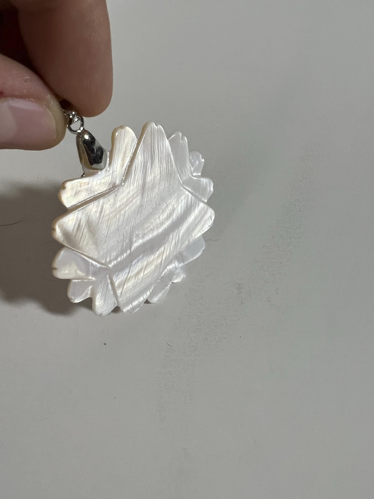 Handcarved Mother of Pearl Shell Floral Pendant. No maker mark found.