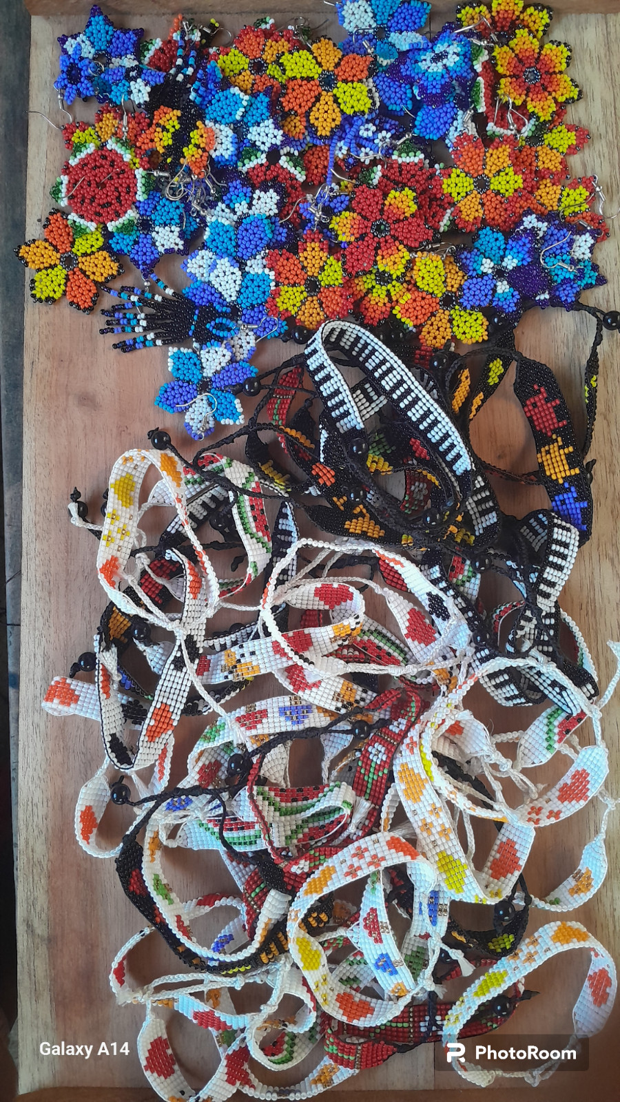 42 BEADED HANDMADE BRACELETS AND 28 PAIRS OF BEADED HANDMADE EARRINGS(LOT OF 70)