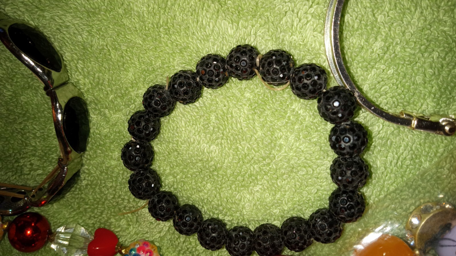 MULTIPLE FASHION BRACELETS MOST STRETCHY BUT SOME PRETTY ONES, SOME SIGNED BRASS