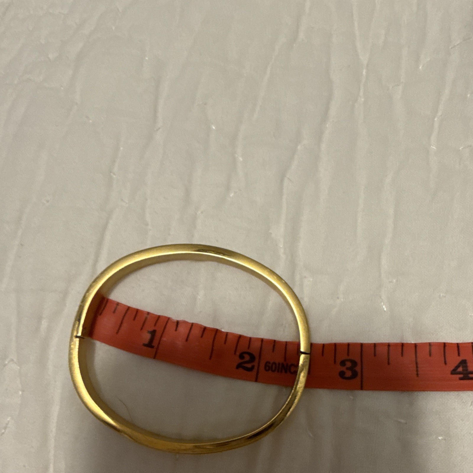 Gold Tone Logo Motif Bangle Bracelet, No Stone, Gold Color Jewelry