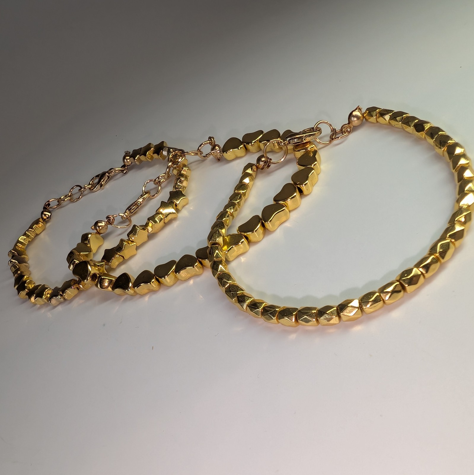 Lot of 3 Gold Tone Bracelets with Star Heart And Geometric Beads, Lobster Clasp