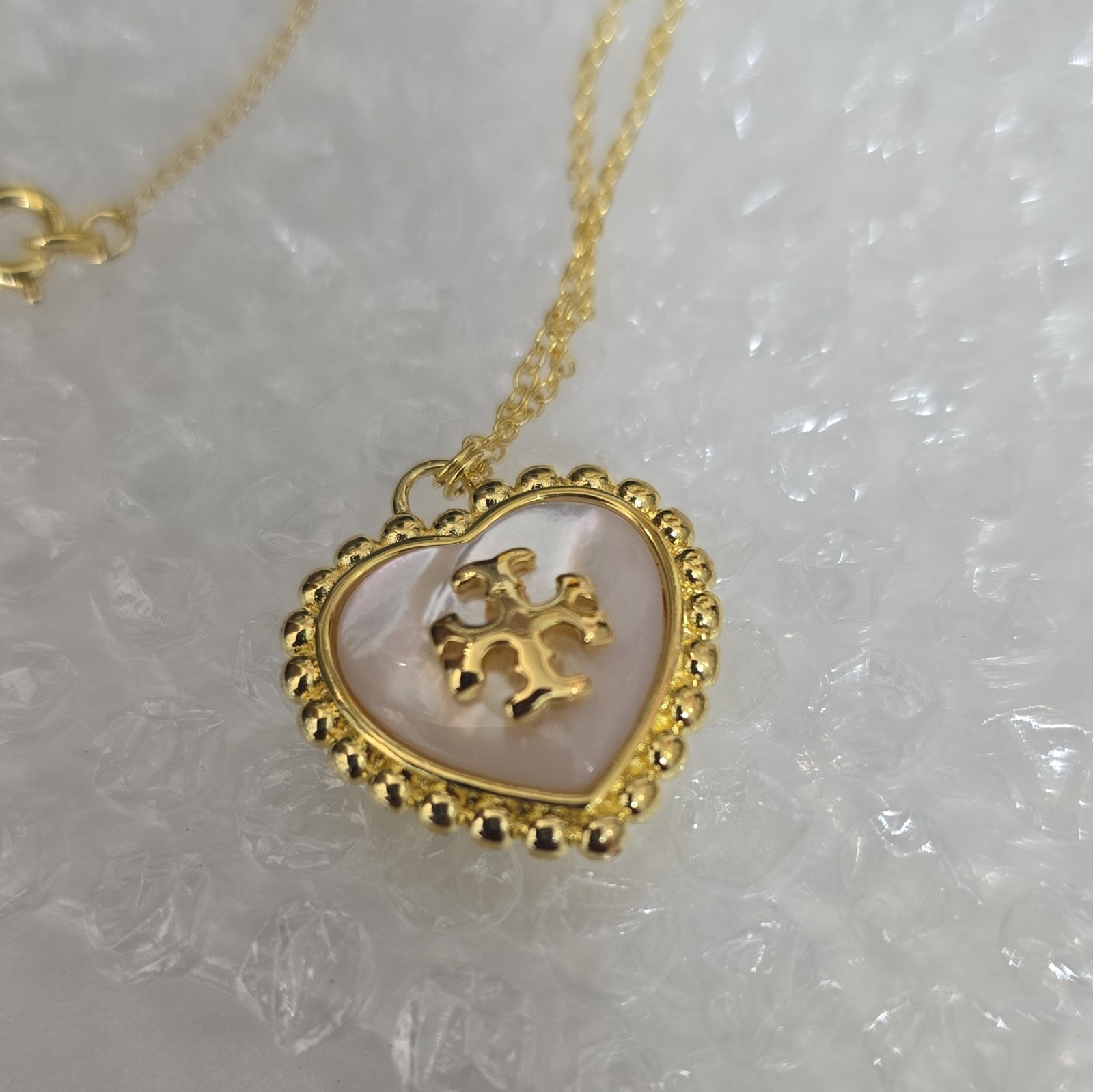Tory Burch Gold Tone Mother of Pearl Heart Charm Pendant Necklace Cable Lobster
