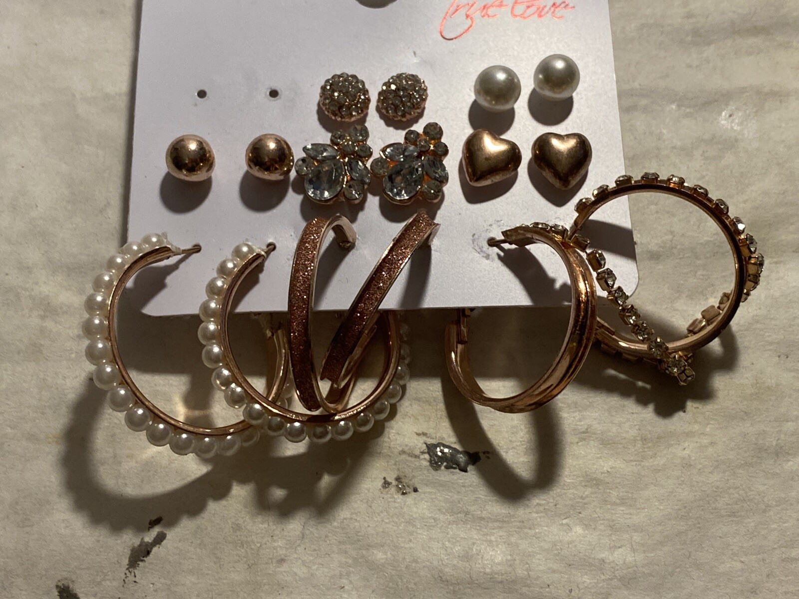 8 Pair Of Pierced Earrings On A Card