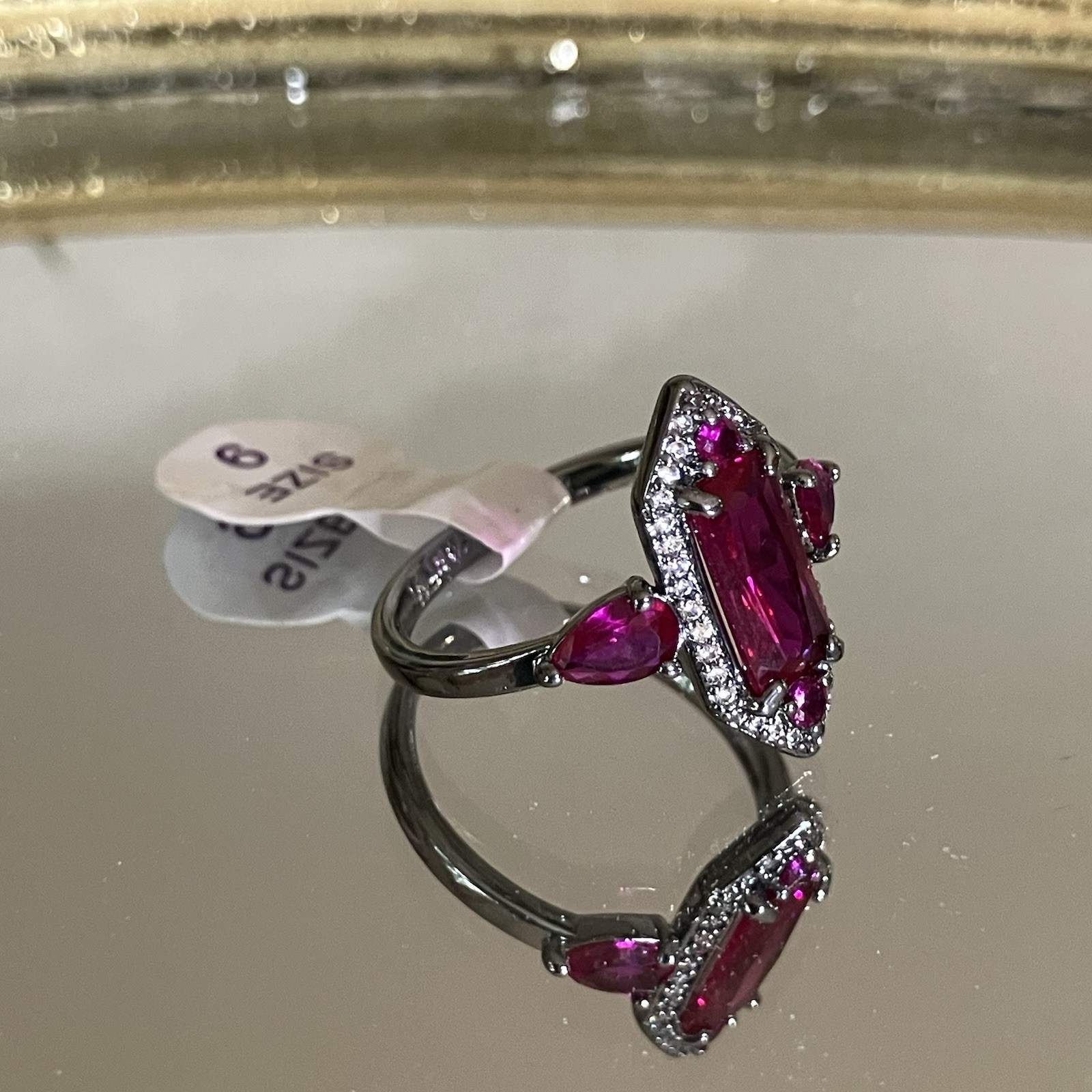 Bomb Party “The Calliope Ring” Lab Ruby Hematite Plating July 2026 RG43302 Sz 9