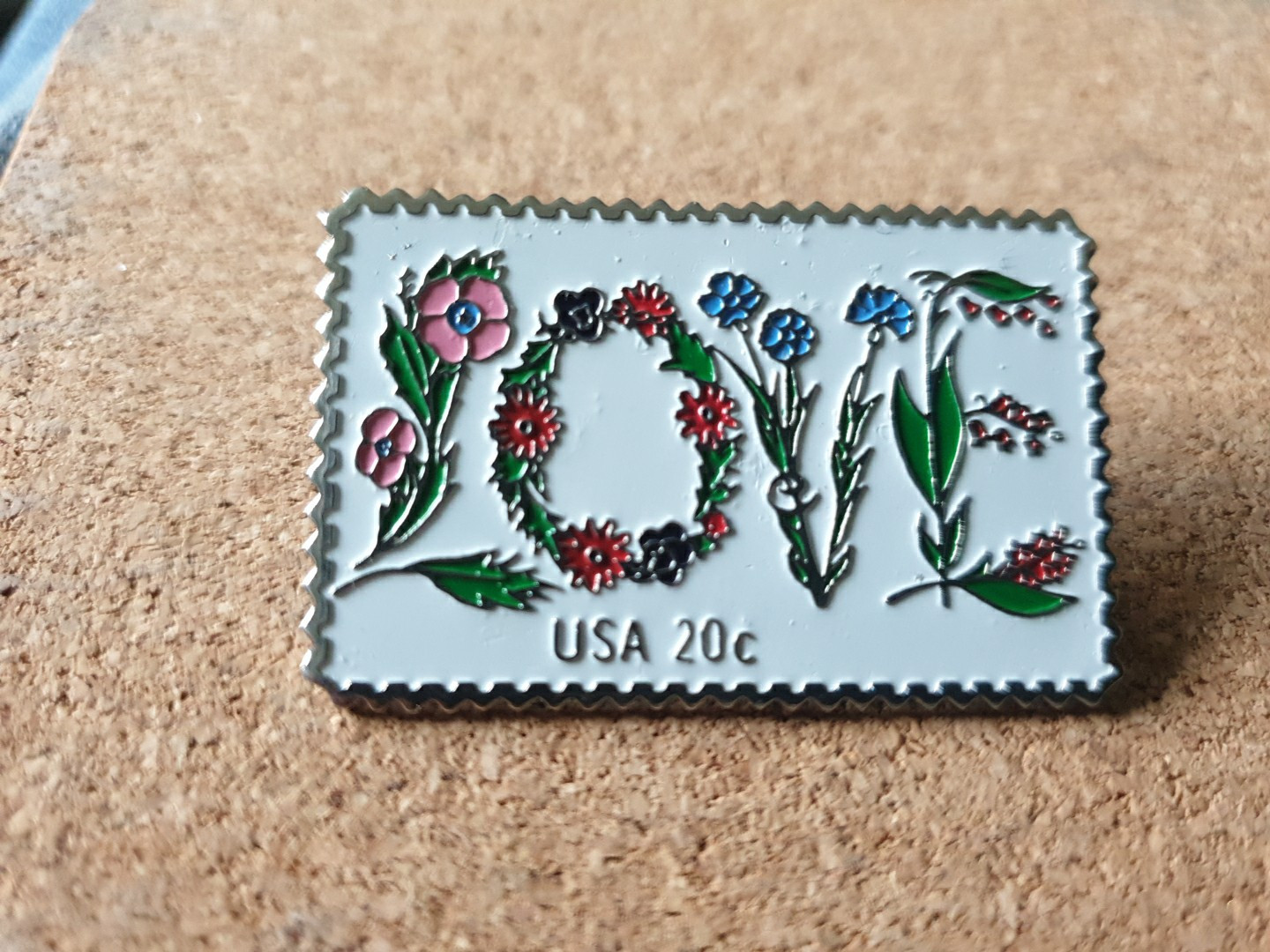The March Co USPS 20c 1982 LOVE Stamp Floral Embossed Lapel Pin Back