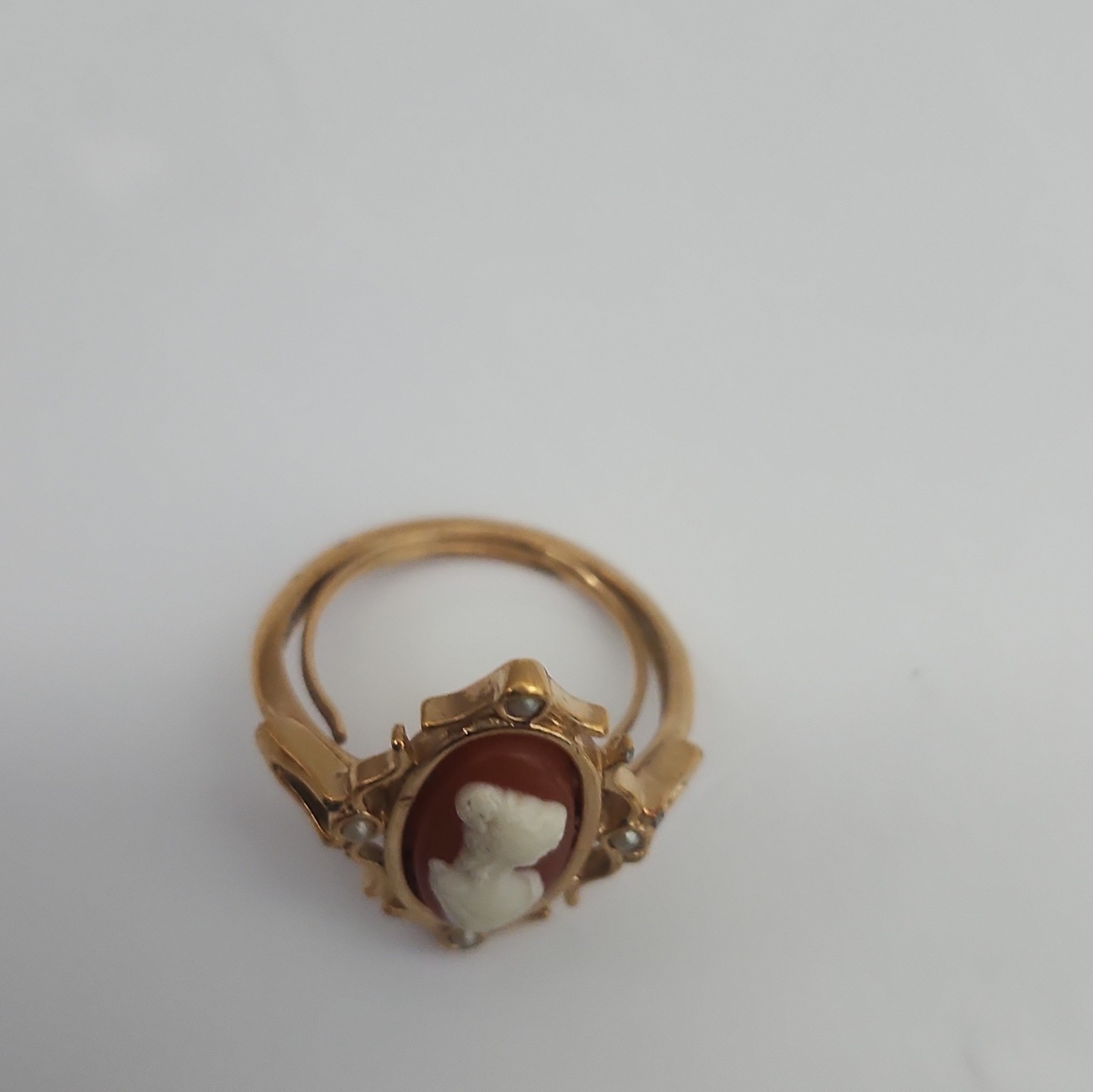 Avon Gold Tone Oval Cameo Ring Red/White Bezel Set Signed Adjustable Sz 8