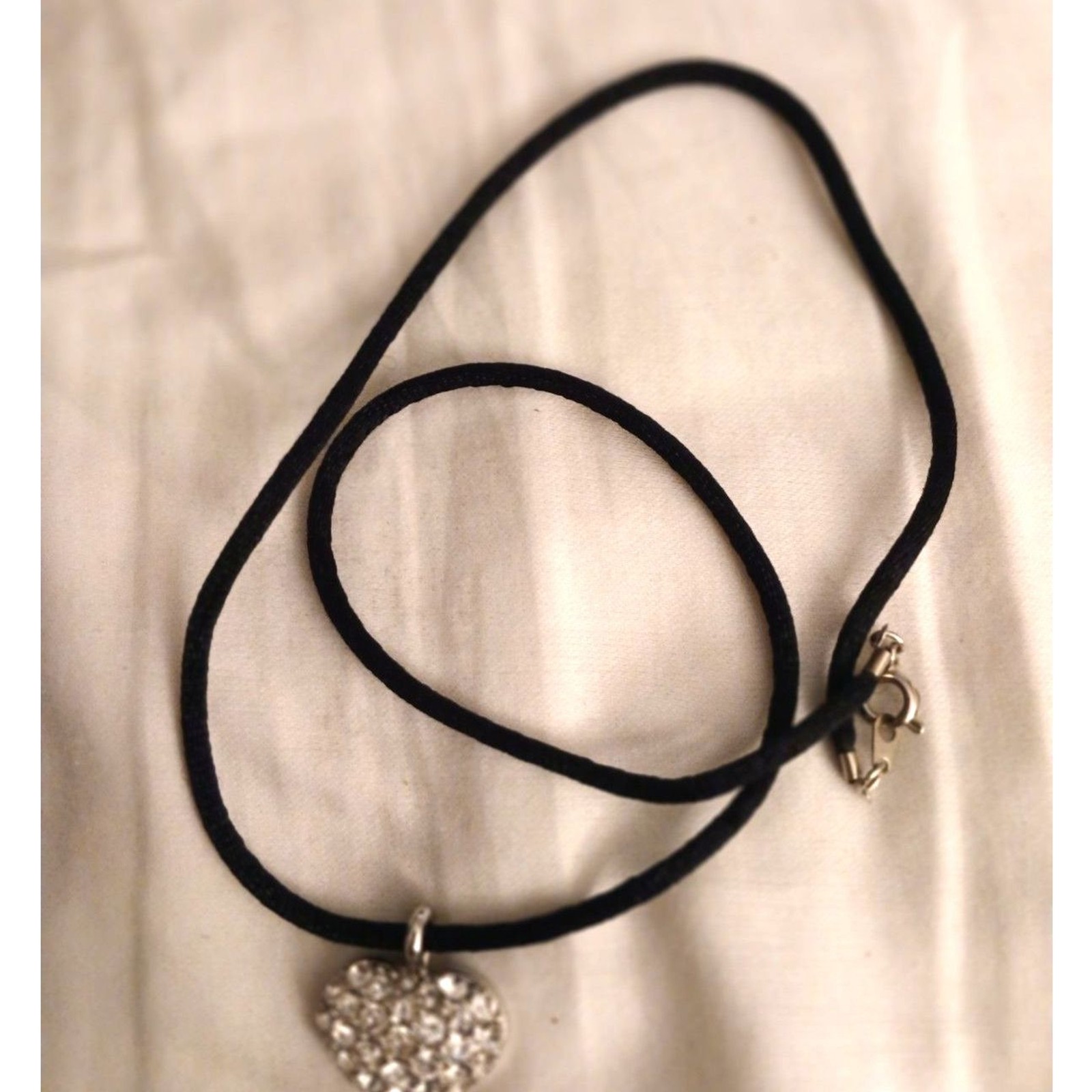 Josten’s silver tone tiny heart pendant rhinestones black cord