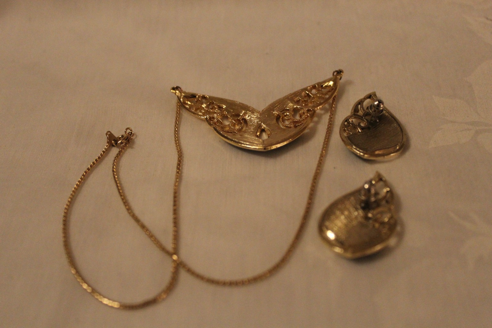 Filligree style necklace 17in and earrings. Gold plated with black emerald inlay