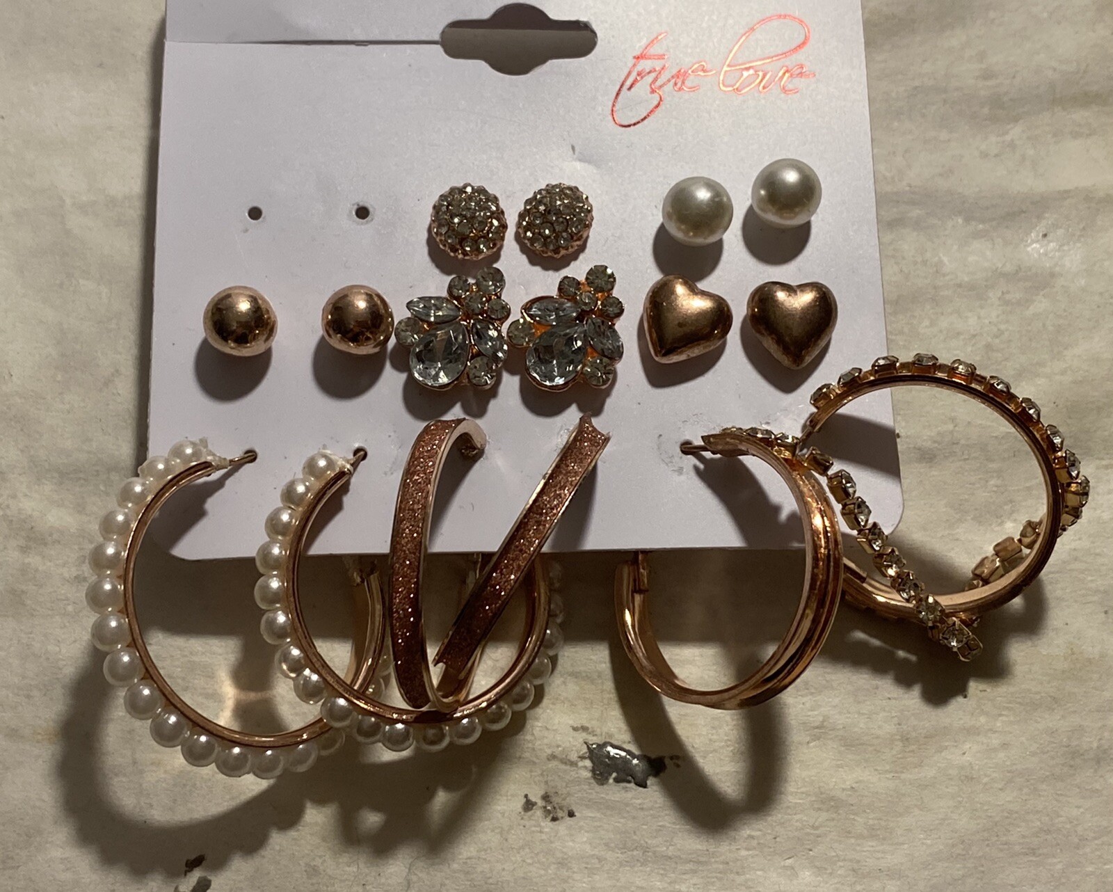 8 Pair Of Pierced Earrings On A Card
