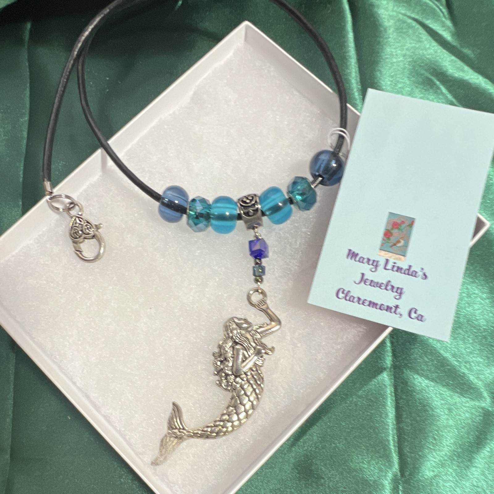 Necklace, leather glass, blue sterling mermaid, ocean lobster claw.