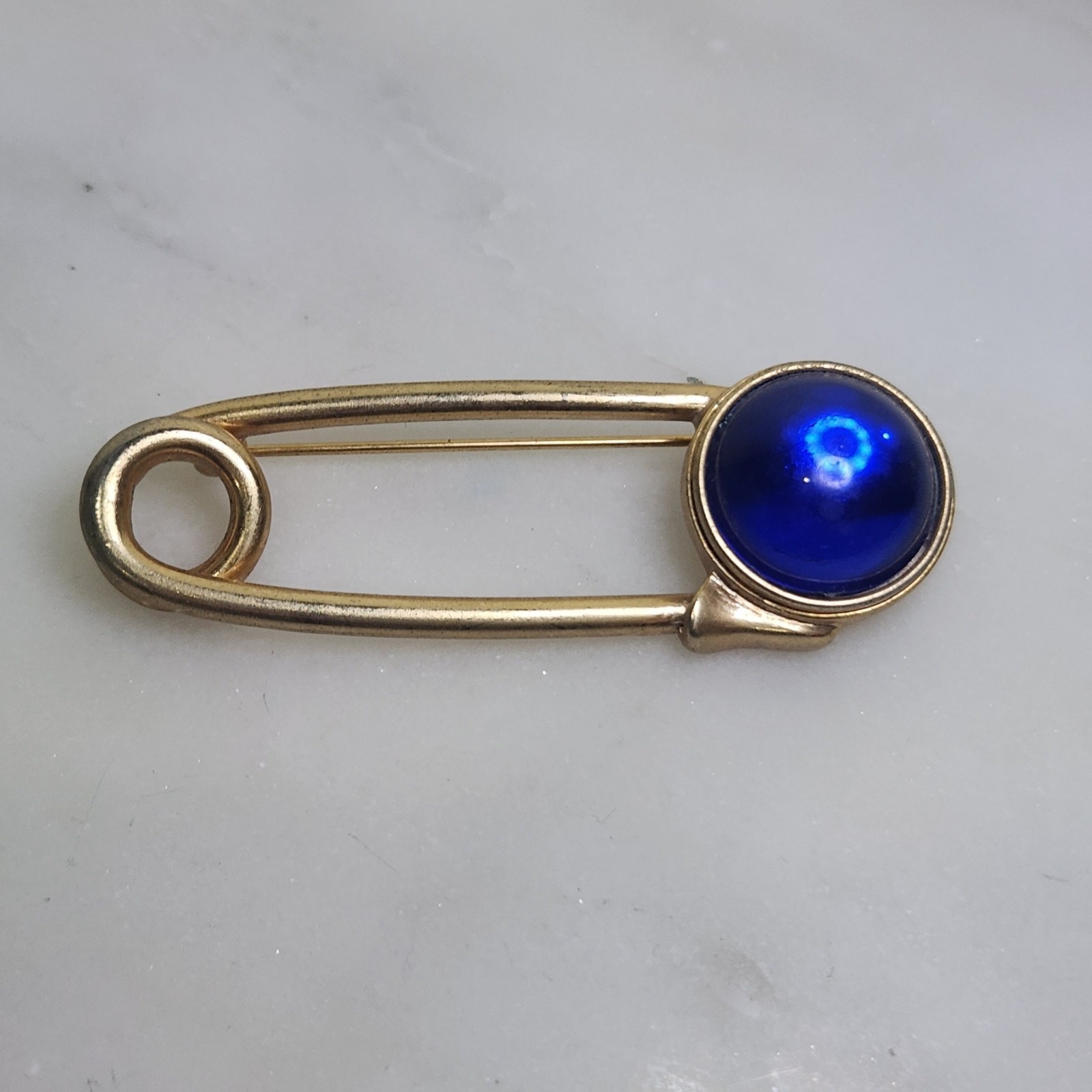 Vintage Swank Gold Tone Safety Pin Brooch Blue Cabochon Stone Lapel Pin MCM