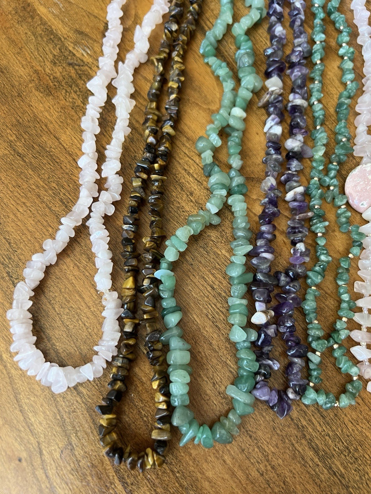 Spectacular lot of natural stone necklaces in pink, green, and brown