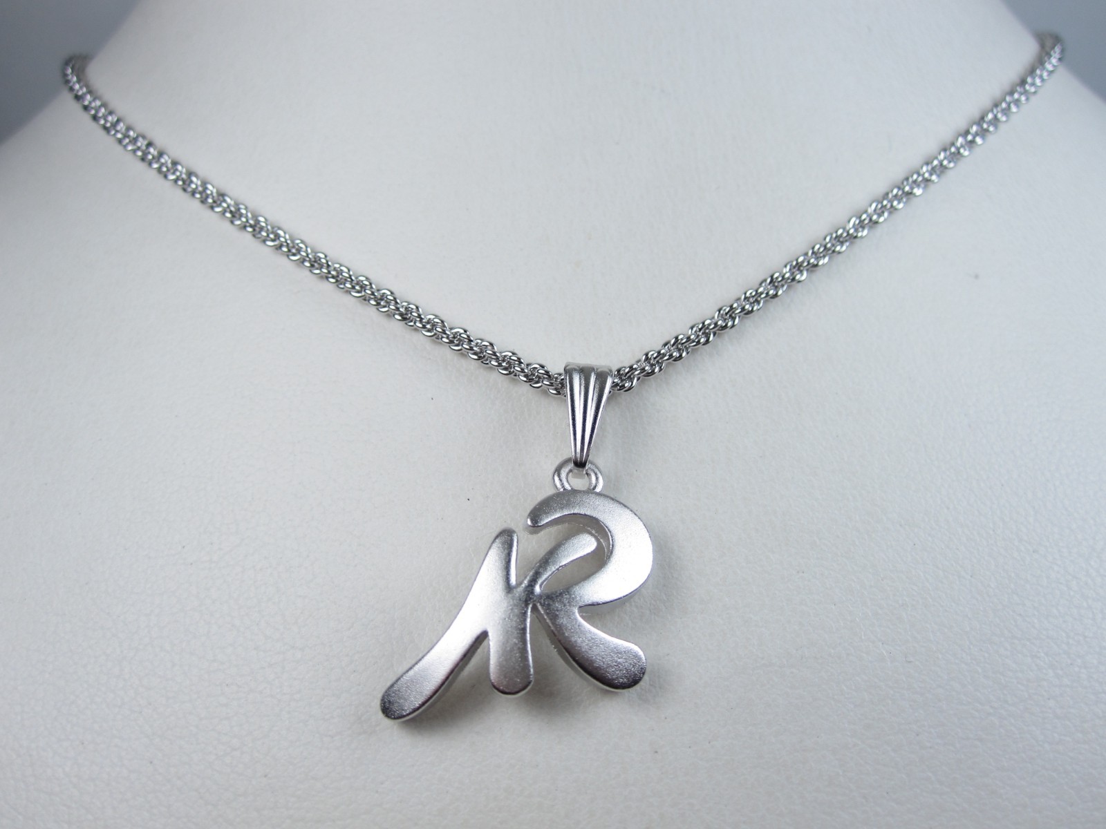 Nina Ricci Rhodium Plated Pendant 16-18″ – 9561