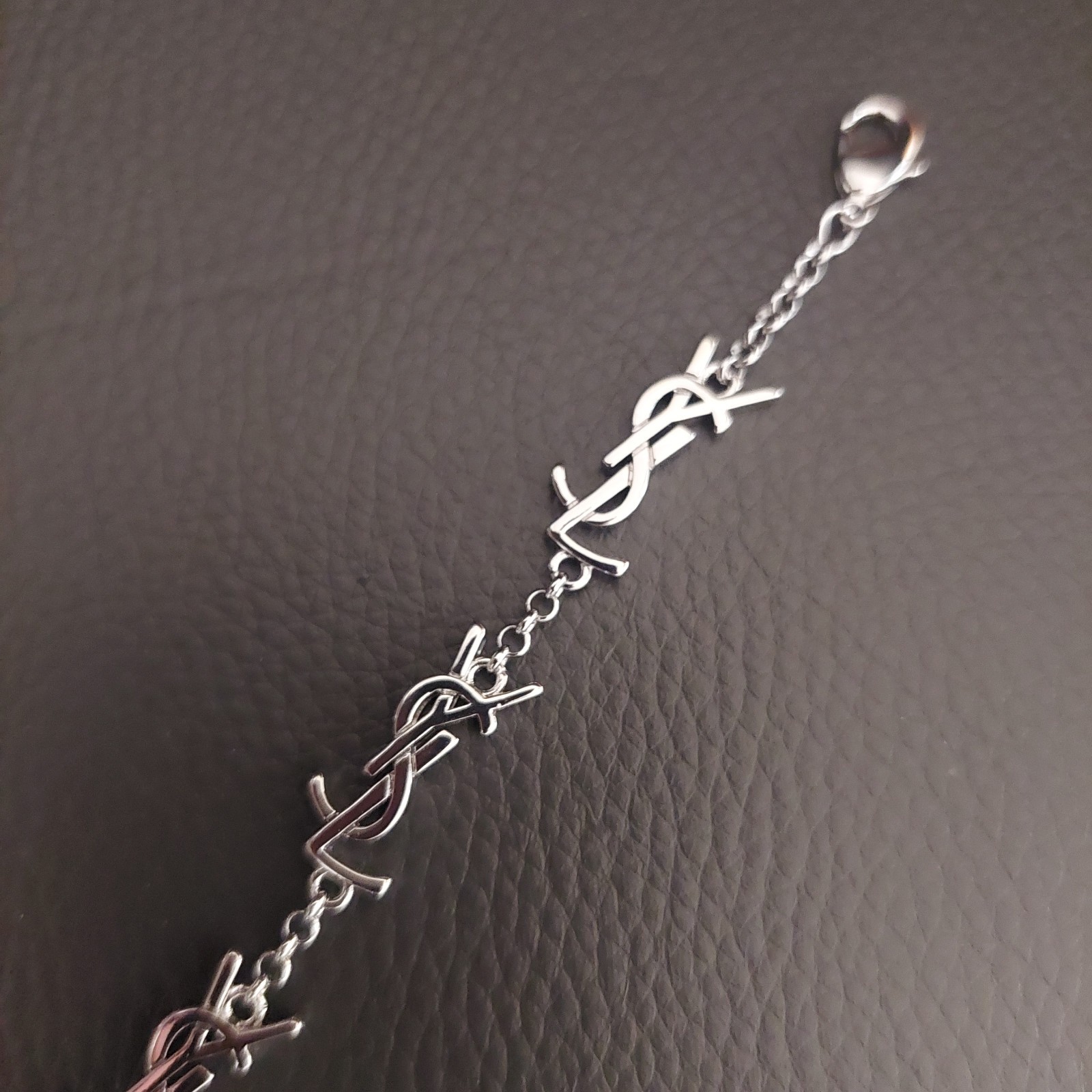 YSL Saint Laurent Silver Tone Logo Charm Bracelet