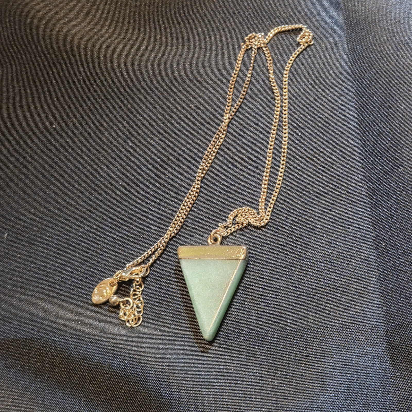 Gold-tone Chain With A Green Triangle Gemstone Pendant, Sleek And Elegant.