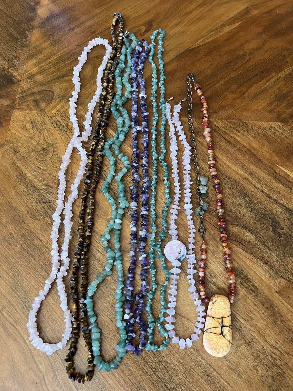 Spectacular lot of natural stone necklaces in pink, green, and brown