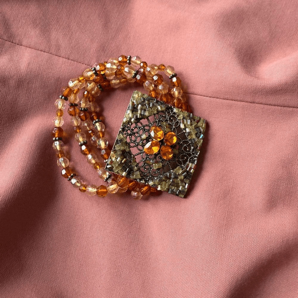 Y2K Multi-stranded Bracelet with a faux Amber Glass, Gems Statement Pendant