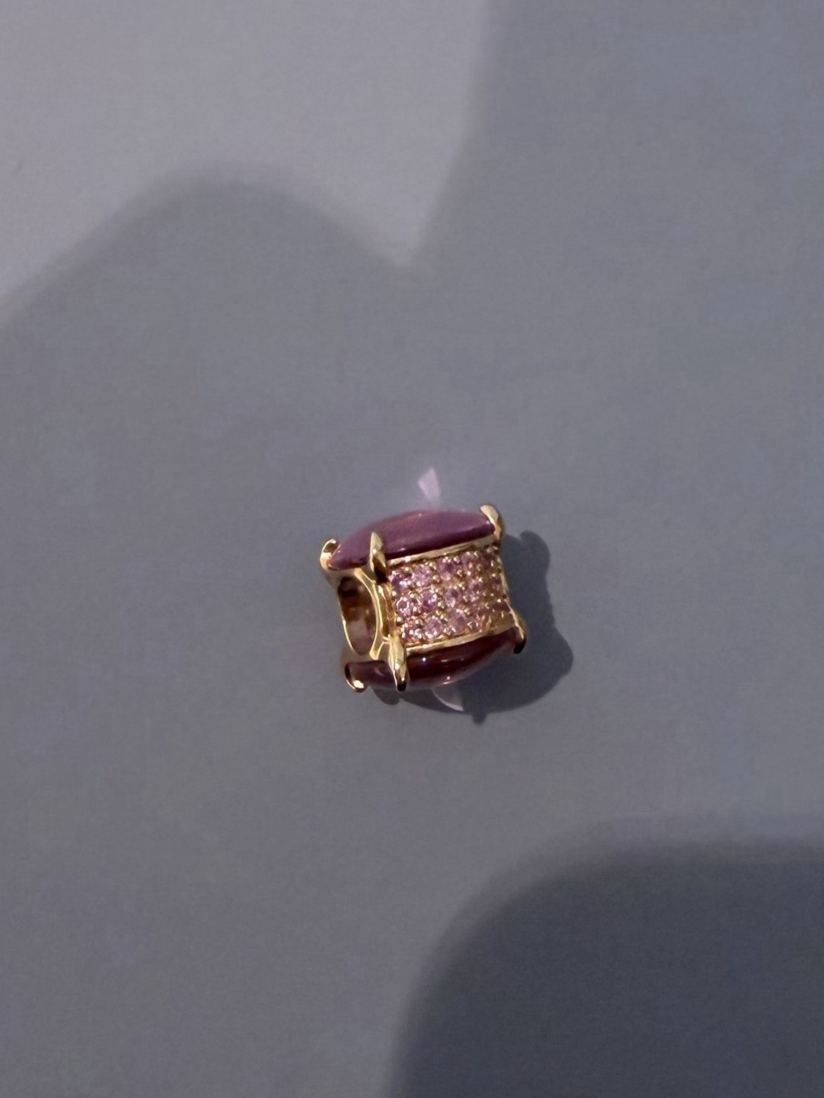 Pandora rose gold pink gem charm.