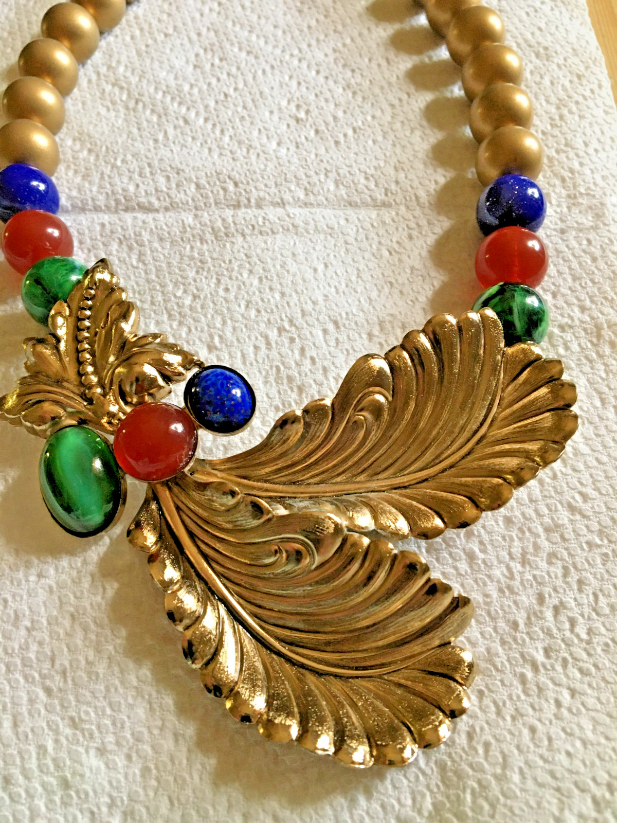 Ornate 18″ Necklace Golden + Stamped Metal Feathers? + Drilled Glass Beads