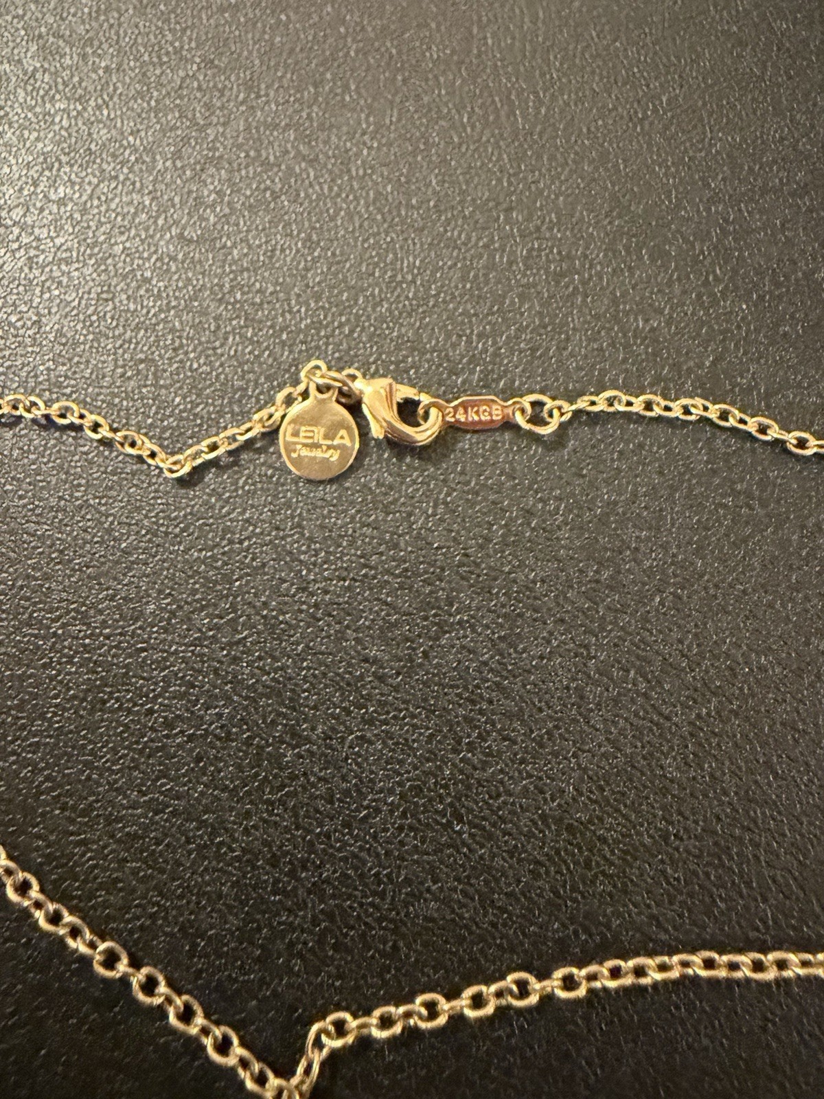 LEILA Jewelry Gold Tone Lucky Charm Necklace w/ Hamsa, Elephant & Wishbone 18in