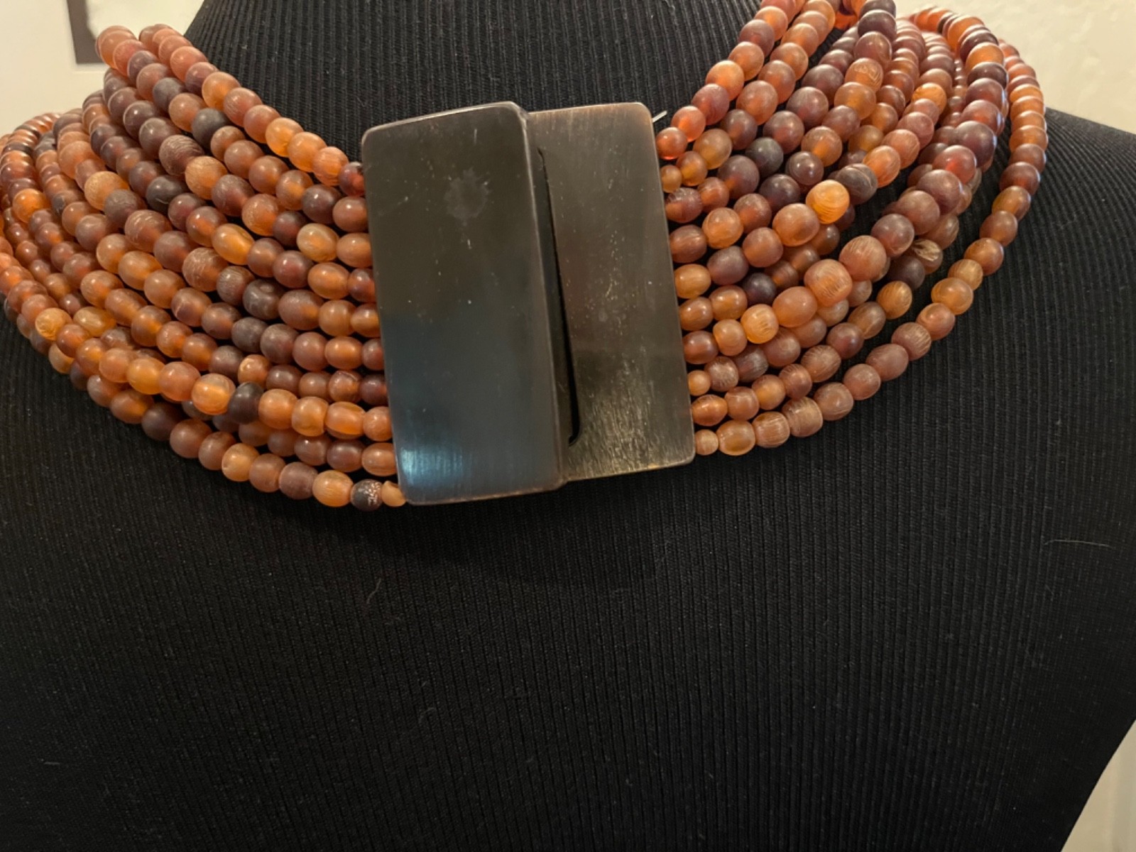 Multilayer warm brown draped necklace possibly acrylic brown clasp
