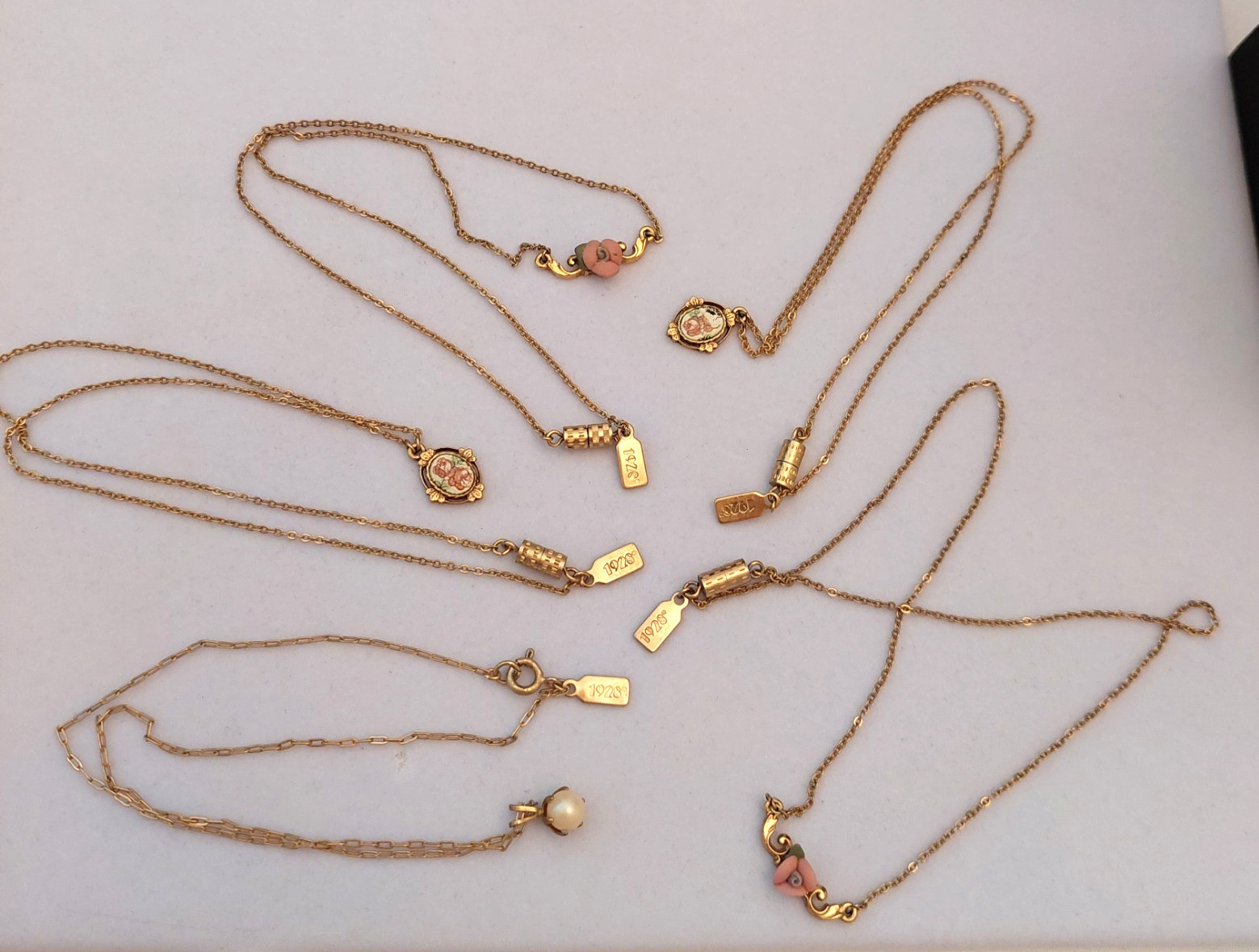 5 Gorgeous 1928 Brand Delicate Gold Tone Necklaces with various charms/looks